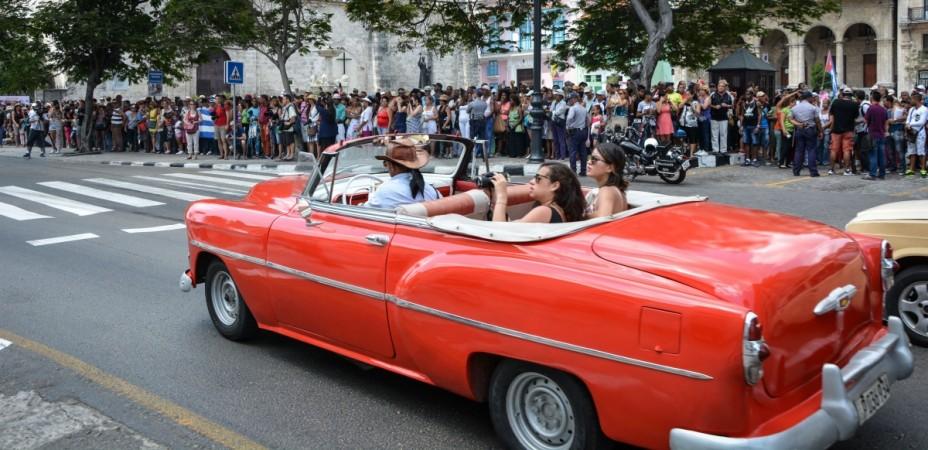 Cubans wait for passengers of the first US-to-Cuba cruise ship to arrive in the island nation in decades, to disembark in the port of Havana, on May 2, 2016. donald trump, trump cuba policy, obama cuba policy, trump administration, trumponomics, cuba us relations