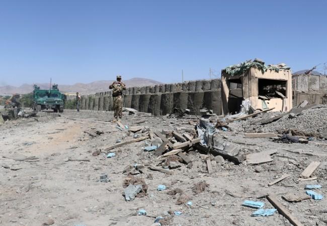 Afghan security forces inspect the aftermath of a suicide bomb blast in Paktia Province, Afghanistan June 18, 2017. Afghanistan