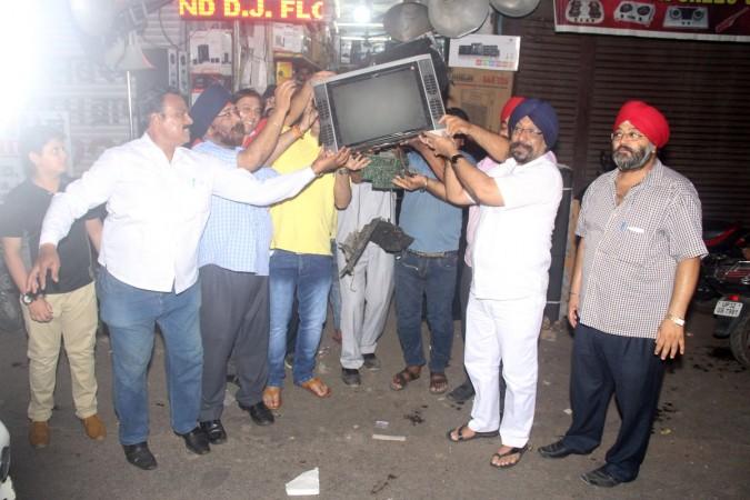 Protesters smash a television set in Lucknow, Uttar Pradesh after India lost to Pakistan in the final of the ICC Champions Trophy 2017 on Sunday, June 18, 2017. Lucknow