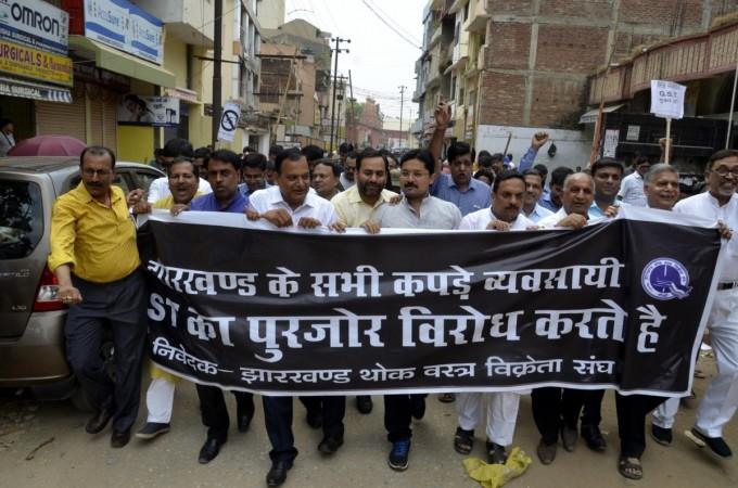 Textile merchants stage a demonstration against GST in Rachi on June 15, 2017. gst, no gst, gst protest, gst strike, gst council, gst rate, gst july 1, gst modi govt, gst arun jaitley