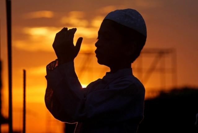 A boy offers evening prayers at a mosque during the holy of Ramadan in Agartala, India. Ramadan, ramadan 2017, eid al-fitr, eid al-fitr 2017