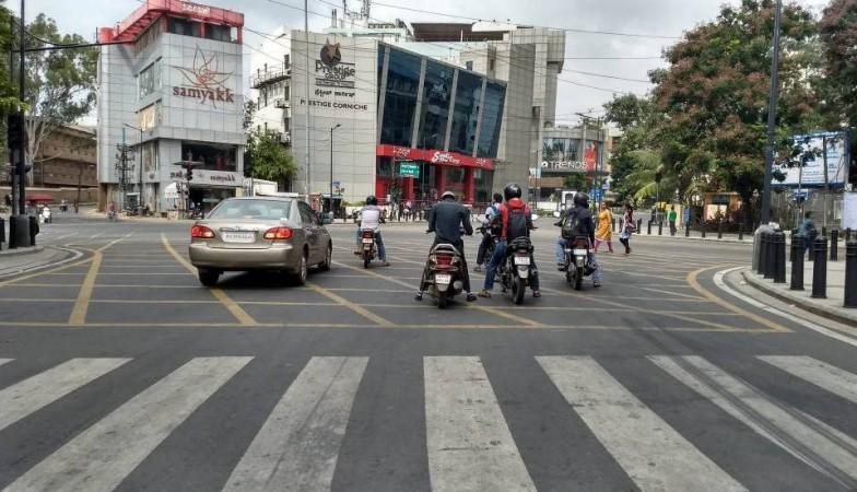 Car and bikes parked beyond zebra crossing at lifestyle juction in Richmond road on June 24, 2017. Traffic violation, traffic