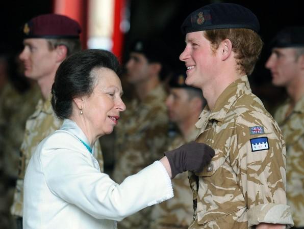 Britain's Princess Anne presents a campaign medal for army service in Afghanistan to Prince Harry in 2008 Prince Harry in Army