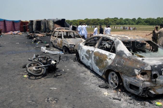 Burnt out cars and motorcycles are seen at the scene of an oil tanker explosion in Bahawalpur, Pakistan, on June 25, 2017. Pakistan