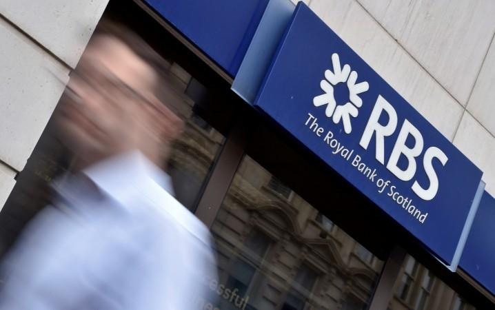 A man walks past a branch of The Royal Bank of Scotland (RBS) in central London, Britain August 27, 2014. Royal Bank of Scotland