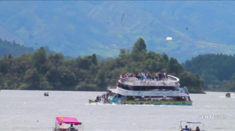 The ferry in Colombia reservoir is seen sinking Colombia boat