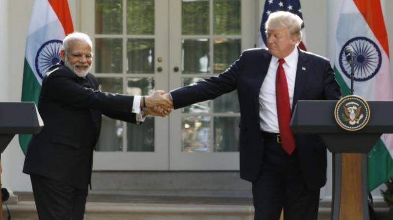 U.S. President Donald Trump (R) greets Indian Prime Minister Narendra Modi during their joint news conference in the Rose Garden of the White House in Washington, U.S. Modi US visit
