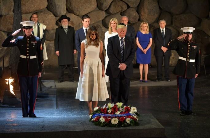 Donald Trump and Melania Trump lay a wreath during a visit to the Yad Vashem Holocaust Memorial museum. Melania trump white dress