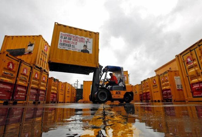 A forklift operator stacks containers at the godown of Agarwal Packers and Movers Ltd. on the outskirts of Mumbai on Thursday. REUTERS/Shailesh Andrade Godown
