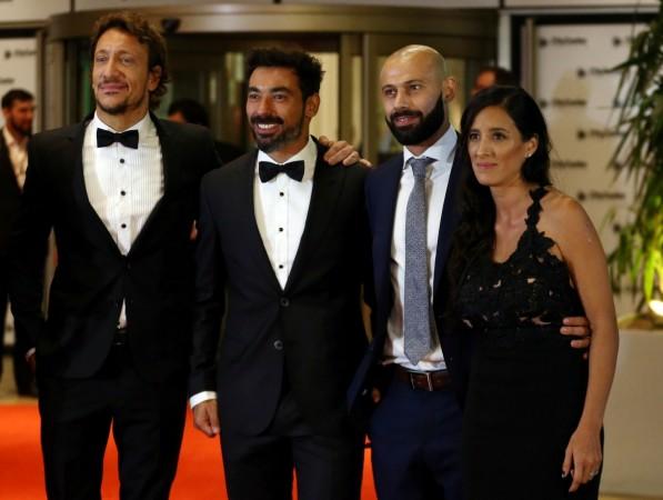 Argentina actor Nicolas Vazquez (L) poses with Ezequiel Lavezzi, Javier Mascherano and his partner Ezequiel Lavezzi and Javier Mascherano
