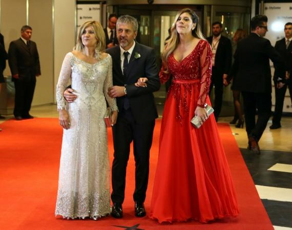 Messi's parents Celia (L) and Jorge (C) pose with sister Maria Sol (R) Messi wedding