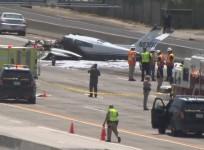 Two injured after plane bursts into flames in crash on motorway