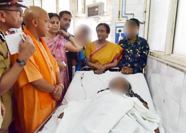 In picture: Uttar Pradesh Chief Minister Yogi Adityanath visits the victim in a Lucknow hospital on March 24, 2017. Yogi Adityanath