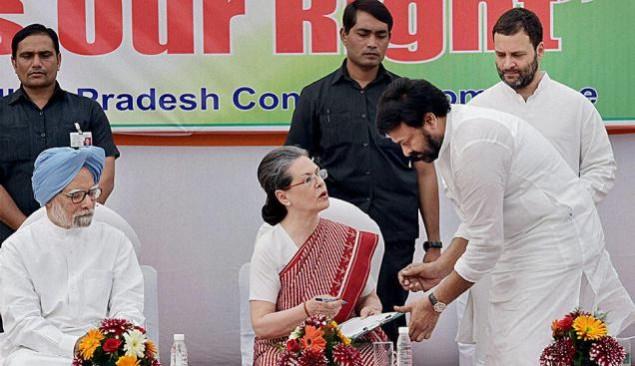 Actor and Congress leader K Chiranjeevi has a word with party President Sonia Gandhi as former Prime Minister Manmohan Singh and party vice president Rahul Gandhi looks on Chiranjeevi with Sonia Gandhi