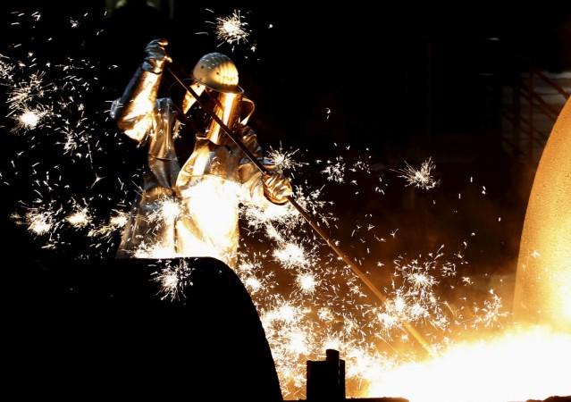 A worker controls a tapping of a blast furnace at Europe's largest steel factory of Germany's industrial conglomerate ThyssenKrupp AG in the western German city of Duisburg in this file photo. REUTERS/Ina Fassbender Thyssenkrupp