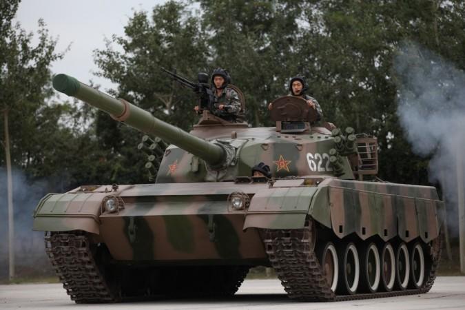 Soldiers drive a tank at the Academy of Armored Forces Engineering of the PLA on July 22, 2014 in Beijing, China. tanks