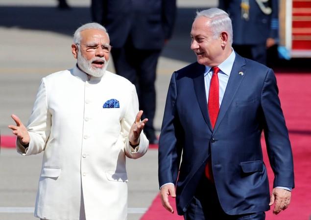 Israeli Prime Minister Benjamin Netanyahu (R) welcomes Indian Prime Minister Narendra Modi during an official welcoming ceremony upon his arrival in Israel at Ben Gurion Airport, near Tel Aviv, Israel July 4, 2017. Modi Israel
