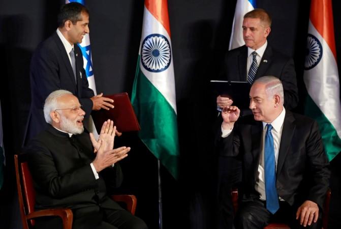 Indian Prime Minister Narendra Modi and Israeli Prime Minister Benjamin Netanyahu exchange jokes during an agreements ceremony in Jerusalem July 5, 2017. Modi Israel