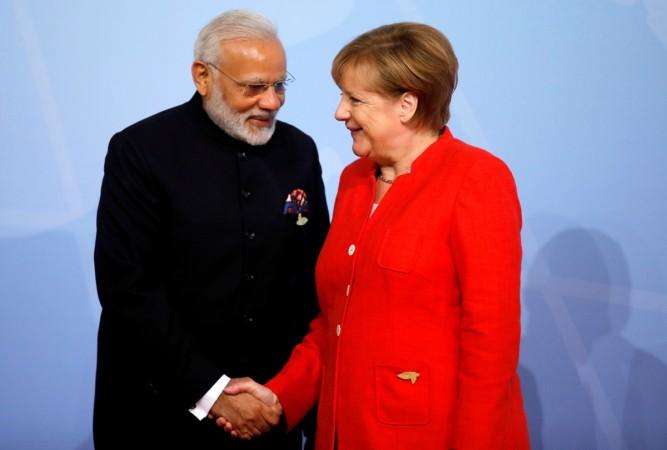 German Chancellor Angela Merkel welcomes Prime Minister Narendra Modi at the G20 summit in Hamburg, Germany July 7. Modi G20 Summit