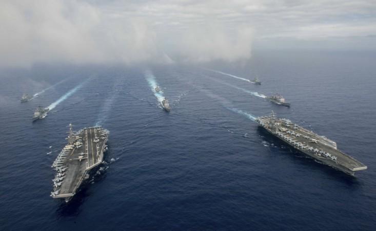 The Nimitz-class aircraft carriers USS John C. Stennis (CVN 74), and USS Ronald Reagan (CVN 76) (R) conduct dual aircraft carrier strike group operations in the U.S. 7th Fleet area of operations in support of security and stability in the Indo-Asia-Pacific in the Philippine Sea on June 18, 2016. USS Ronald Reagan