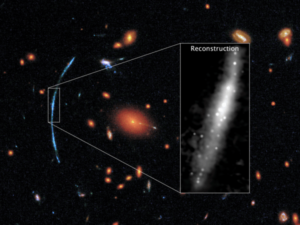 In this Hubble photograph of a distant galaxy cluster, a spotty blue arc stands out against a background of red galaxies. That arc is actually three separate images of the same background galaxy. NASA stars
