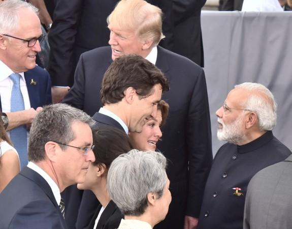 Prime Minister Narendra Modi with the Leaders of G20 Nations, at Hamburg, Germany on July 7, 2017. He is talking to Canadian Prime Minister Justin Trudeau. US President Donald Trump is also seen. Prime Minister Narendra Modi