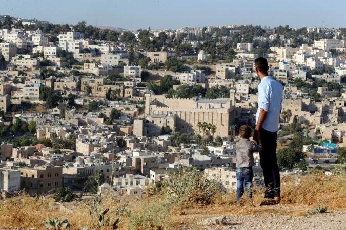 In picture: A general view as Palestinians look at the West Bank city of Hebron on July 7, 2017. Hebron