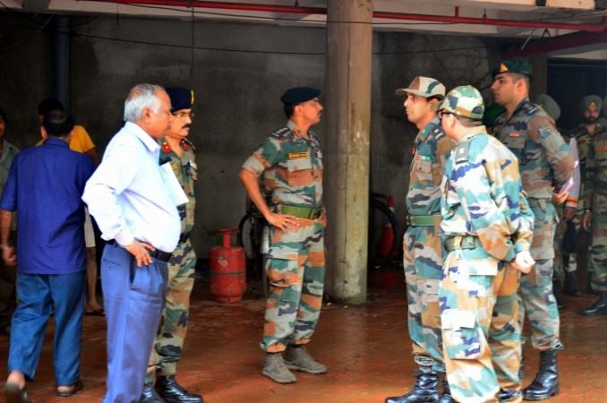 Army personnel arrive at the Adarsh Cooperative Housing Society to take charge of the building following Supreme Court instructions in Mumbai on July 29, 2016. IANS Adarsh housing society