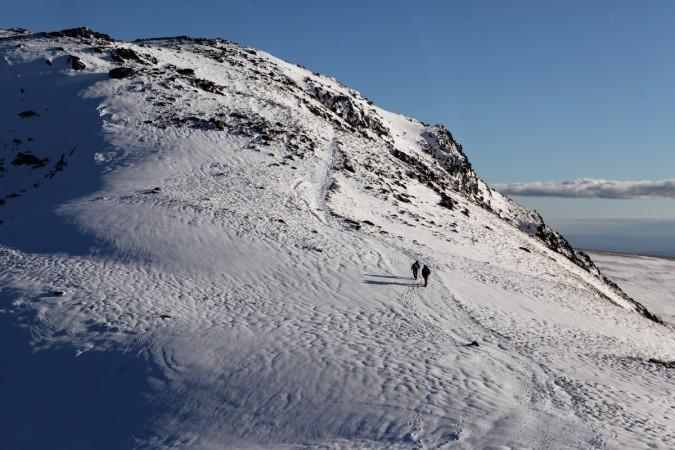 Hill walkers on the Fairfield Horseshoe make their way through early season snow on Dove Crag in the Lake District on November 10, 2010, near Ambleside, England. Lake District