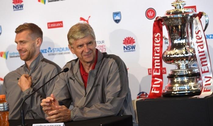 Arsene Wenger and Per Mertesacker during a press conference in Sydney, July 11, 2017 Arsene Wenger, Per Mertesacker, Arsenal, FA Cup trophy, Sydney