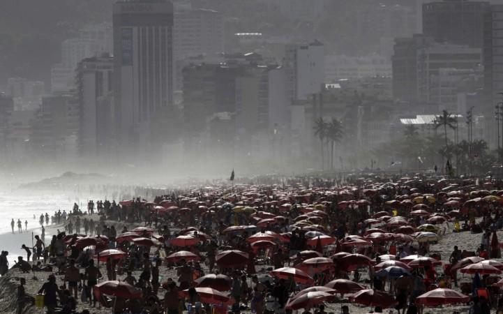 People gather at Ipanema beach in Rio de Janeiro October 23, 2011. World Population Day