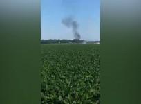 Video shows aftermath of fatal mid-air military plane explosion and crash