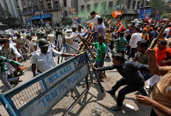 Supporters of India's Bharatiya Janata Party (BJP) try to break a police barricade during a protest against what they call a breakdown of law and order in the state of West Bengal, in Kolkata, India May 25, 2017. Basirhat