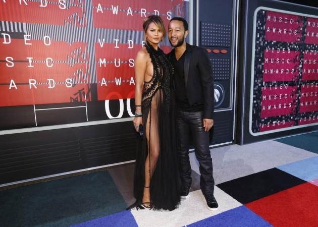 Model Chrissy Teigen and her husband, musician John Legend, arrive at the 2015 MTV Video Music Awards in Los Angeles, California August 30, 2015. Chrissy Teigen