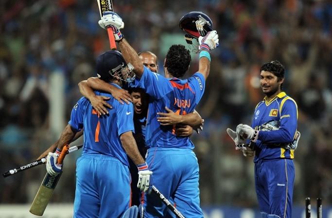 India players celebrate after clinching the 2011 World Cup title as Kumar Sangakkara looks on, April 2, 2011 India, Dhoni, Yuvraj, Kumar Sangakkara, Sri Lanka