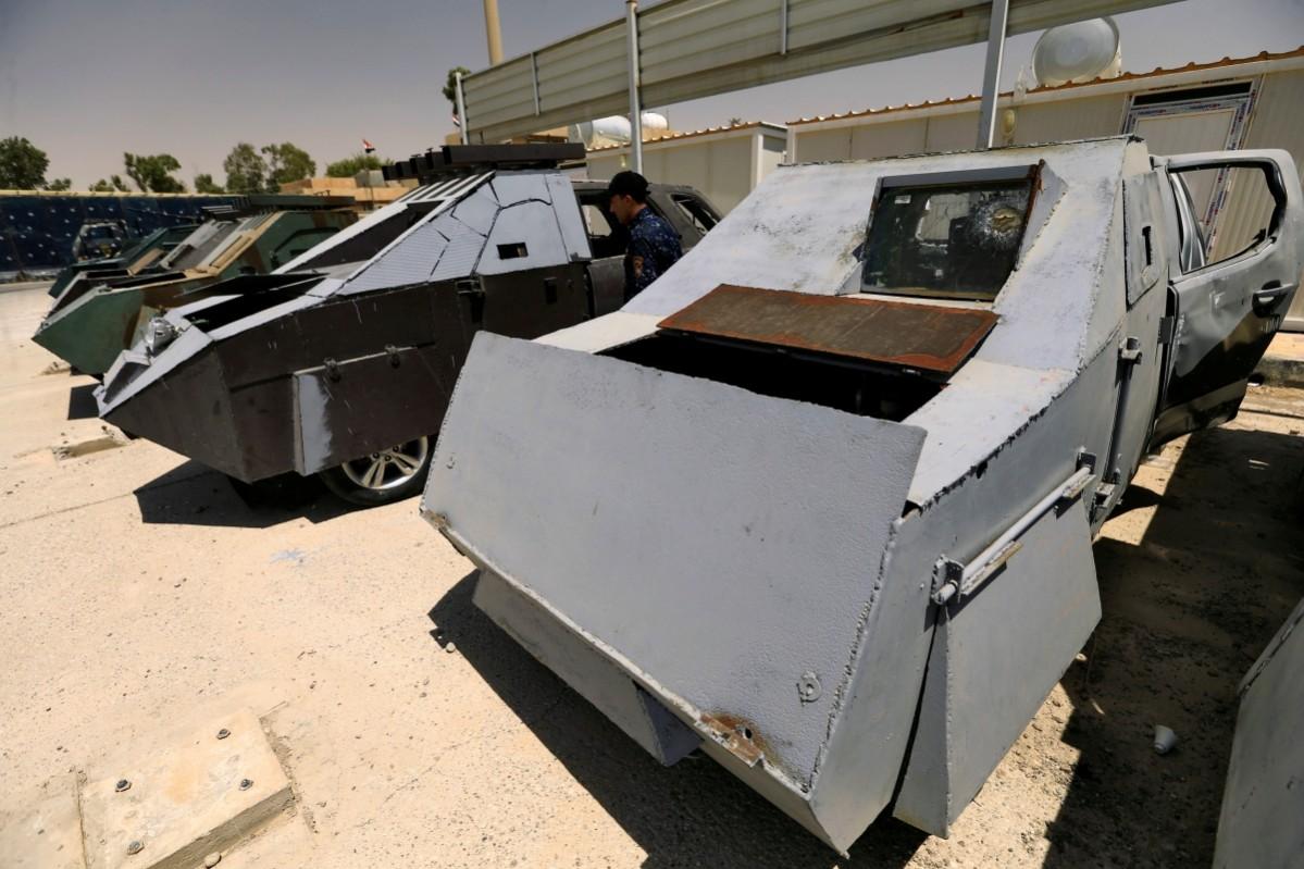 Vehicles used for suicide car bombings, made by Islamic State militants, are seen at Federal Police headquarters after being confiscated in Mosul ISIS vehicles, ISIS vehicle exhibition, ISIS cars