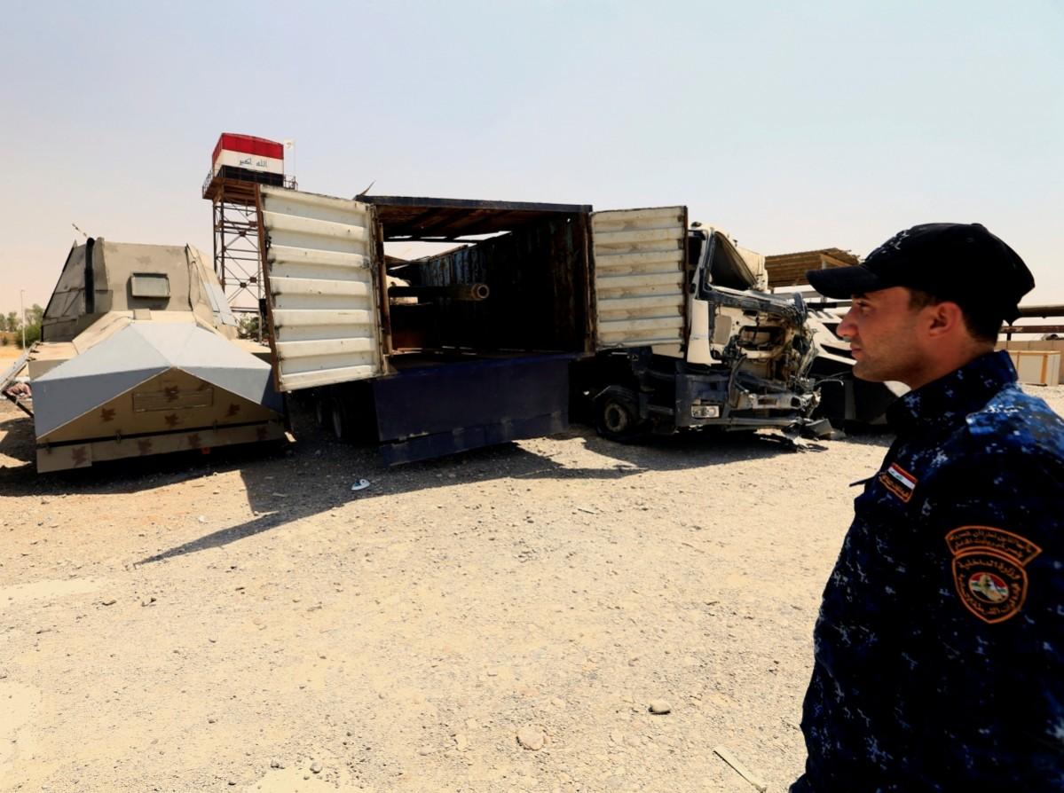 A member of Federal Police inspects vehicles used for suicide car bombings, made by Islamic State militants ISIS Weapons, ISIS cars, ISIS Mosul