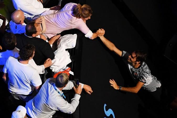 Roger Federer of Switzerland and his wife Mirka Federer celebrate with the Norman Brookes Challenge Cup after Federer won the Men's Final match against Rafael Nadal of Spain on day 14 of the 2017 Australian Open at Melbourne Park on January 29, 2017 in Melbourne. Roger Federer and Mirka Federer