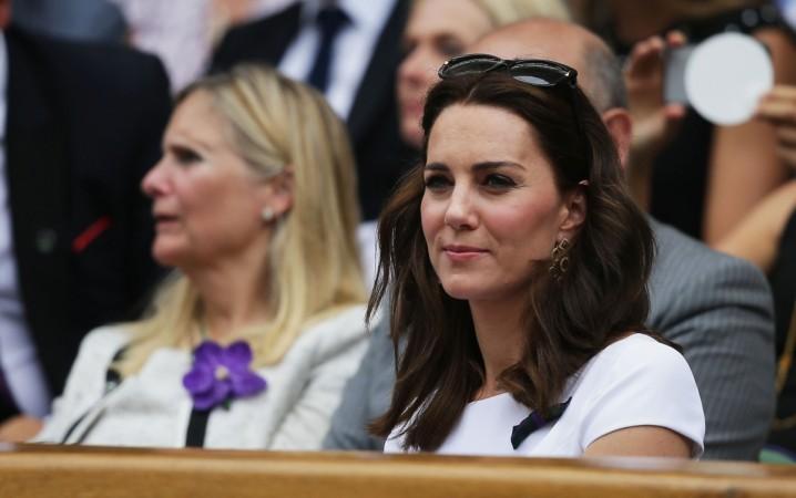 Kate Middleton, dressed in white, enjoys the Wimbledon match kate middleton dresses