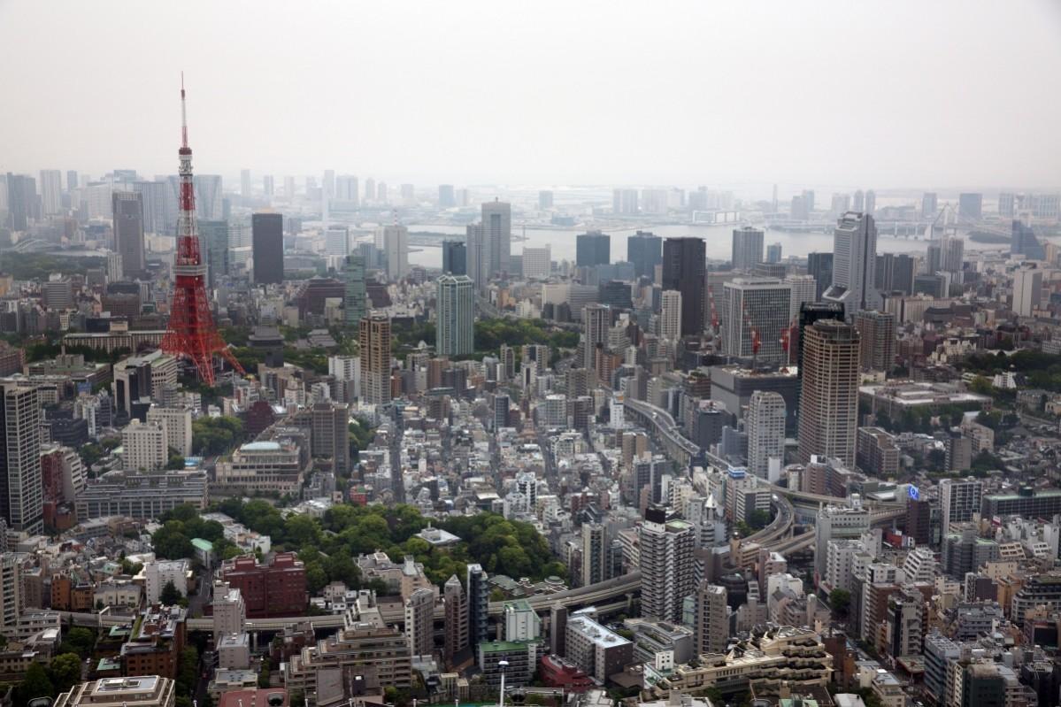 The Tokyo Tower (L) is pictured from the top of the Roppongi Hills Mori Tower on May 02, 2016 in the Roppongi area of Tokyo, Japan. Tokyo