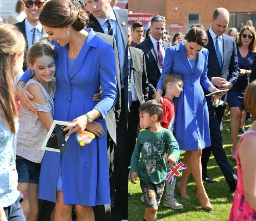 The Duchess of Cambridge hugs kids in Berlin kate middleton dresses