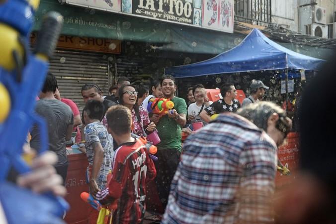 Revellers having a water fight during Songkran - or Thai new year - on Khao San road, a popular tourist destination in Bangkok. Revellers having a water fight during Songkran - or Thai new year - on Khao San road, a popular tourist destination in Bangkok.