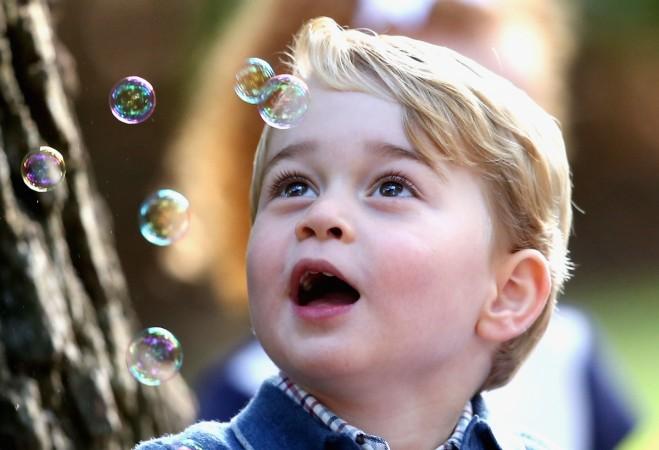 Prince George of Cambridge plays with bubbles at a children's party for Military families during the Royal Tour of Canada on September 29, 2016 in Victoria, Canada. Prince George