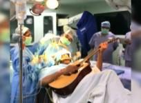 Musician plays guitar during his own brain surgery