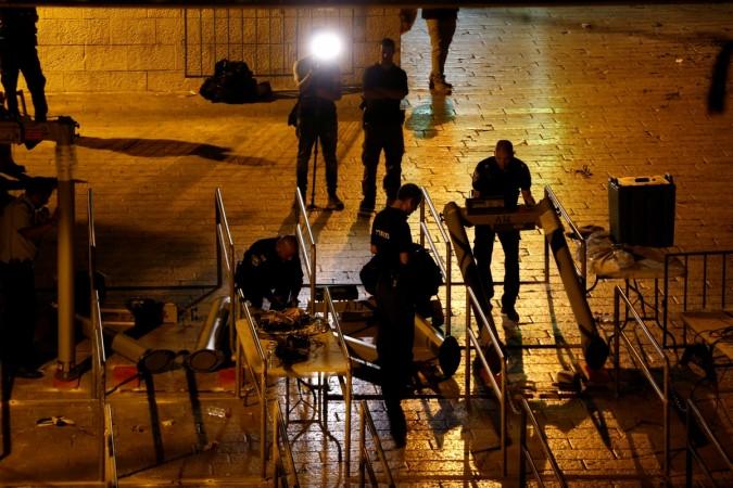 Israeli security forces remove metal detectors which were recently installed at an entrance to the compound of the Al-Aqsa mosque in Jerusalem's Old City Israel