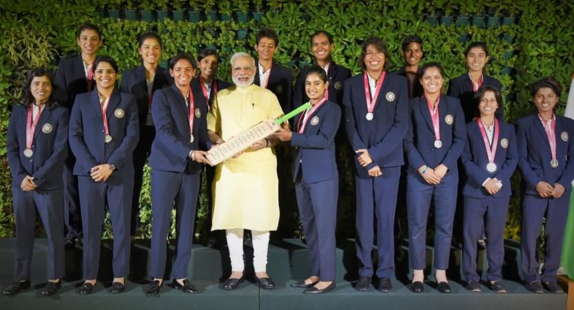 The women's team gifted a signed cricket bat to PM Modi on Thursday PM Narendra Modi with India women's cricket team