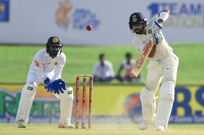 Virat Kohli plays a nice shot through the offside during his impressive innings on day three, July 28, 2017 Virat Kohli, India, Niroshan Dickwella, Sri Lanka, 1st Test