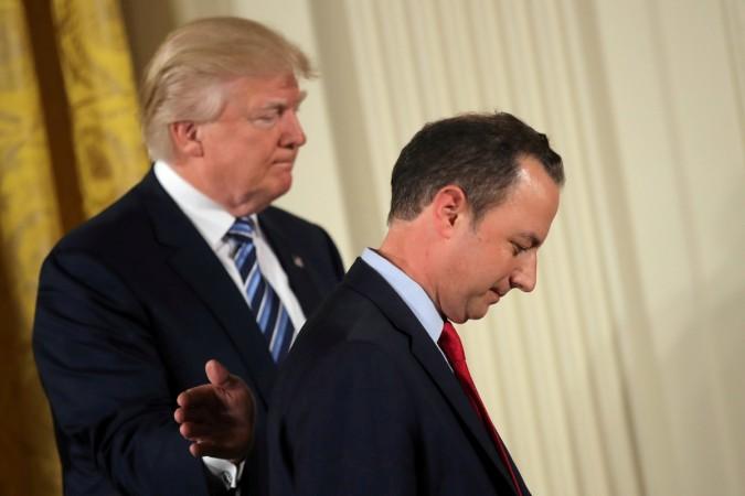 US President Donald Trump congratulates White House Chief of Staff Reince Priebus during a swearing in ceremony for senior staff at the White House in Washington, DC January 22, 2017. Reince Priebus