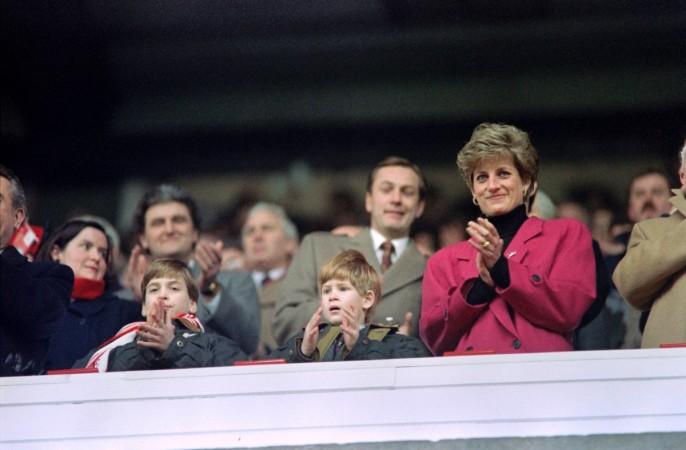 Diana, Princess of Wales, (R), Princes William (L) and Harry applaud during the Wales vs France Five Nations Cup match at Cardiff Arms Park on February 1, 1992. Princess Diana