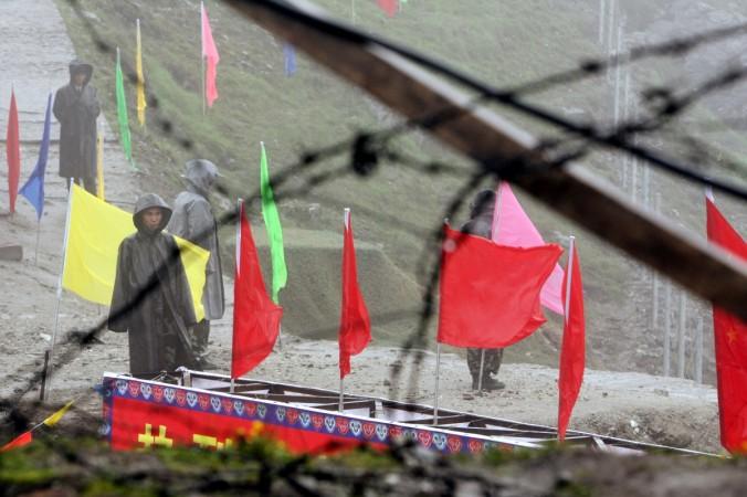 Chinese soldiers guard the Nathu La mountain pass, between Tibet and the tiny northeastern Indian state of Sikkim, July 6, 2006 Nathu La
